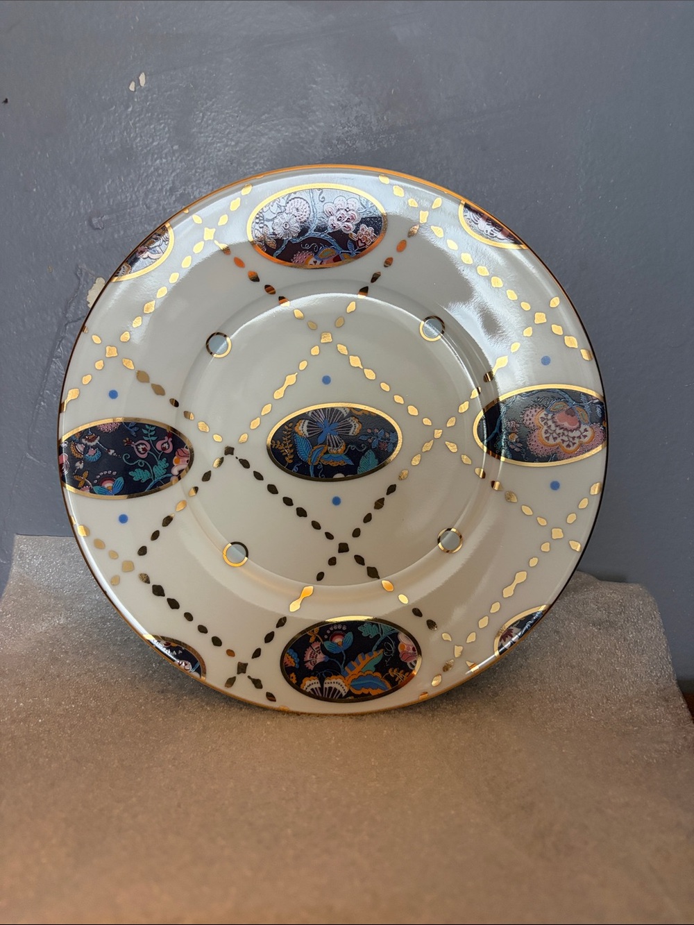 Anthropologie Cream Saucer with Gold Lattice and Navy Floral Medallions